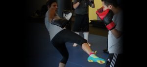 woman performing a martial arts kick
