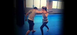 martial arts class training with excrima sticks