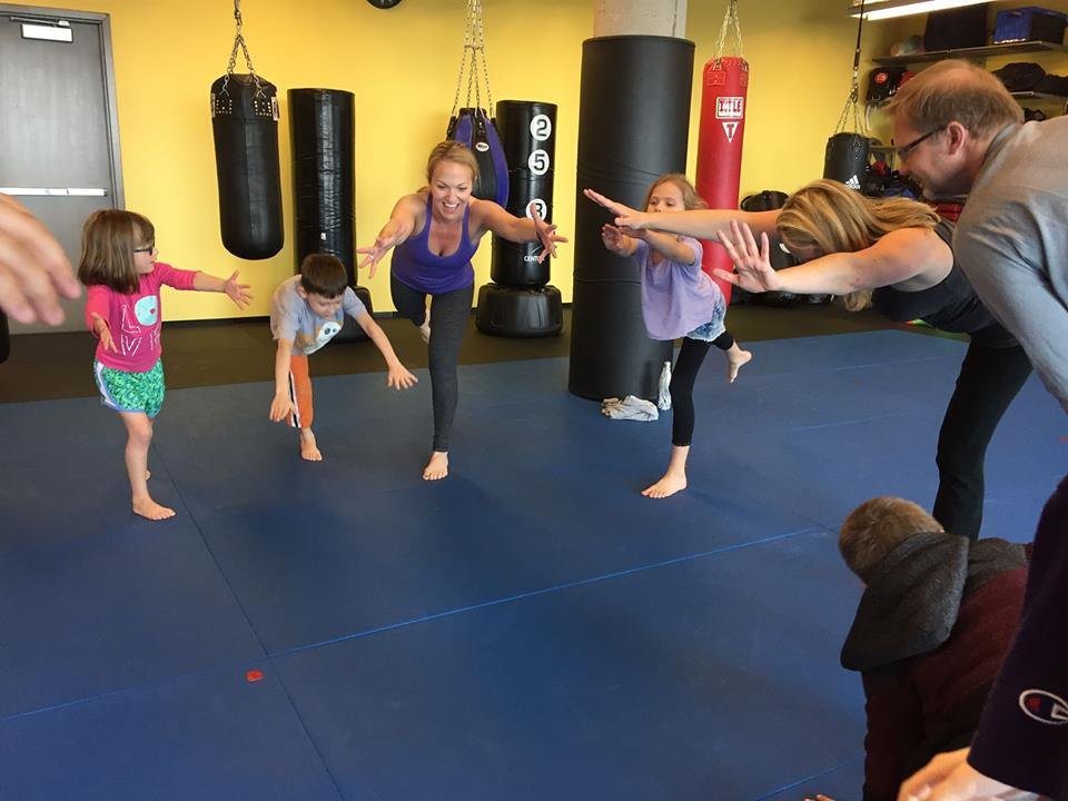 Moms and children doing yoga